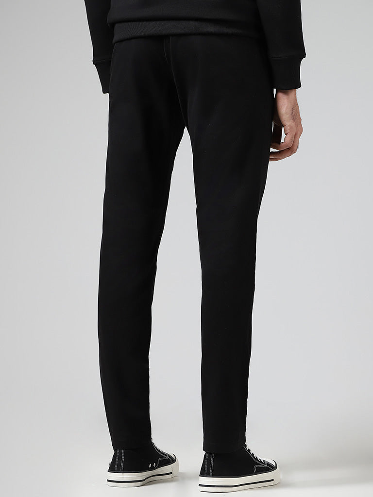 WES Casuals Solid Black Relaxed-Fit Mid-Rise Chinos - Image 4