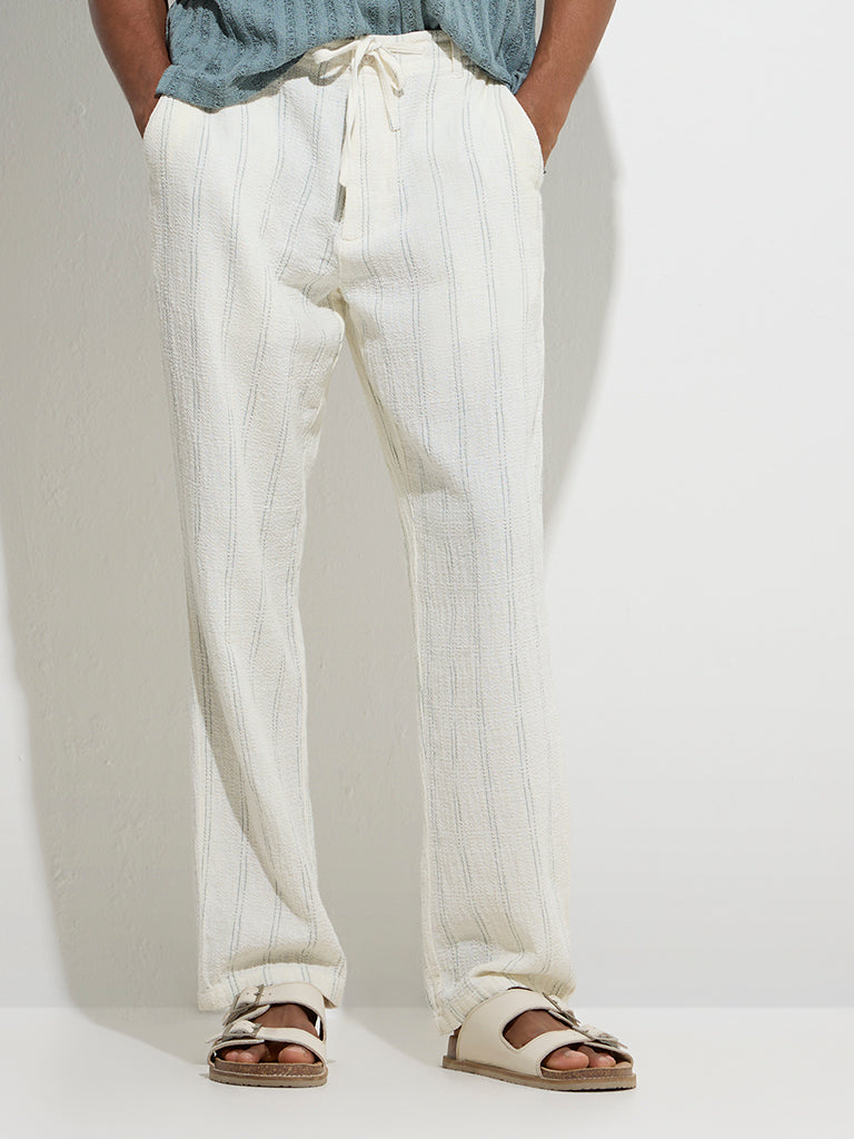 ETA Off-White Stripe Printed Relaxed-Fit Mid-Rise Cotton Chinos - Image 2