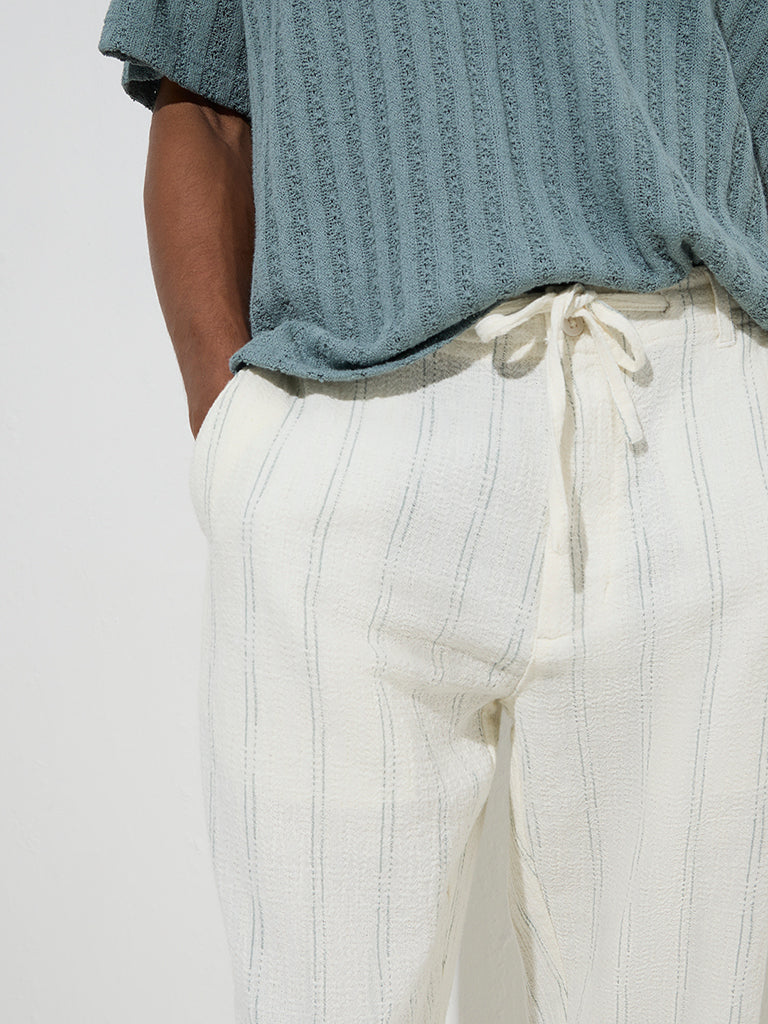 ETA Off-White Stripe Printed Relaxed-Fit Mid-Rise Cotton Chinos - Image 3