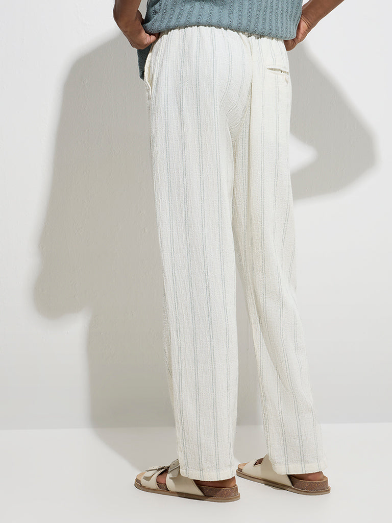 ETA Off-White Stripe Printed Relaxed-Fit Mid-Rise Cotton Chinos - Image 4