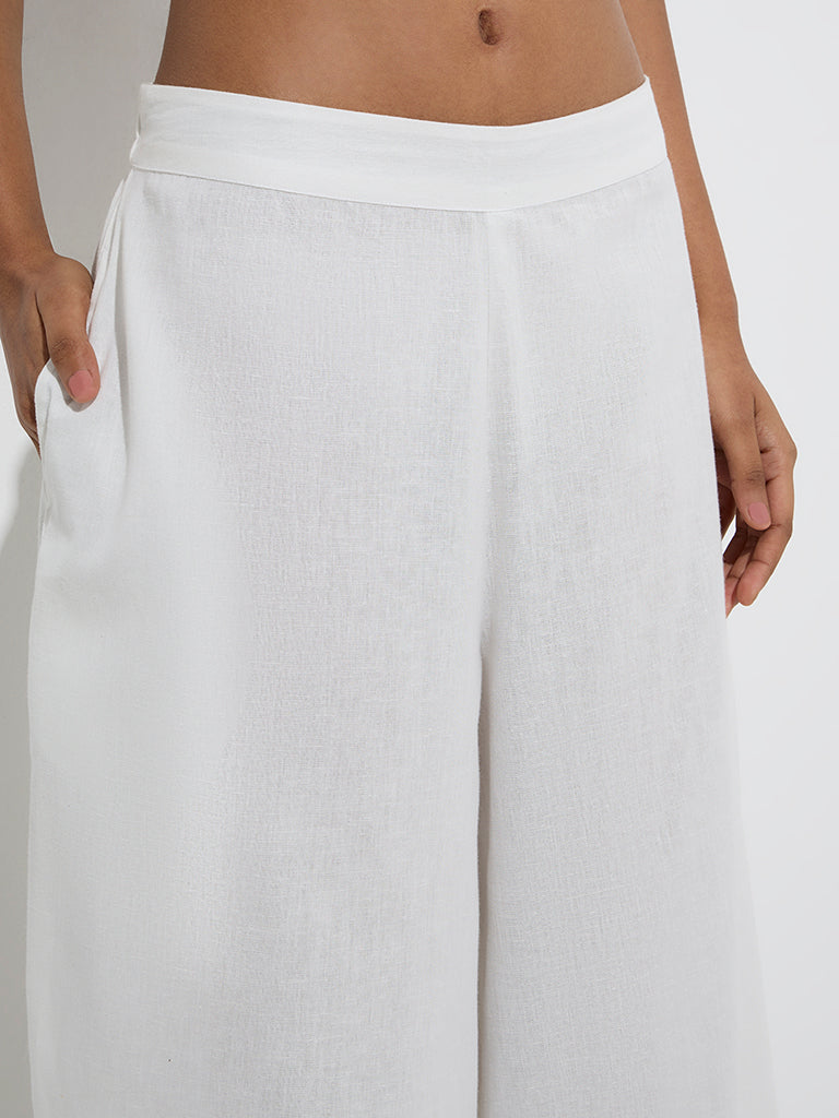 Utsa White Solid Cotton Palazzos - Image 3