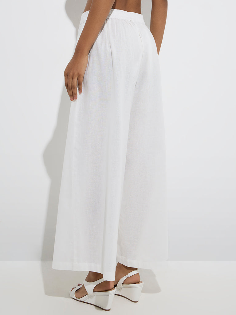 Utsa White Solid Cotton Palazzos - Image 4